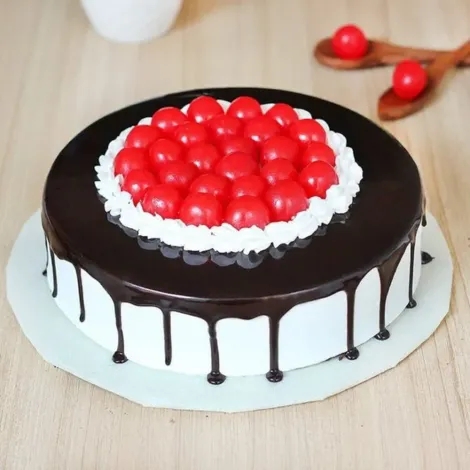 Half Choocolate Half Vanilla Cake with cherry on top